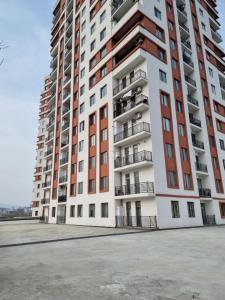 a tall apartment building with balconies on it at daily rent Taha Plaza in Tbilisi City