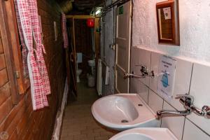 a small bathroom with a sink and a toilet at Home Puščava in Kranj +9 photos