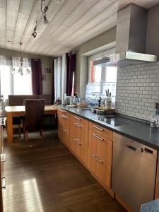 a kitchen with a counter top and a dining room at Apartment Roth in Roth