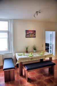 a dining room with a table and two chairs at Appartement an der historischen Heuwaage in Ohrdruf