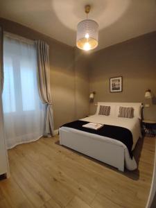 Postel nebo postele na pokoji v ubytování Manno Rooms Affittacamere