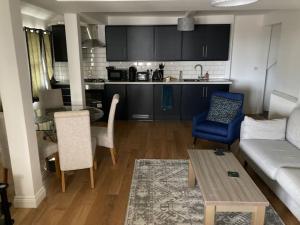 a living room with a couch and a kitchen at 50 meters from Beach. in Bognor Regis