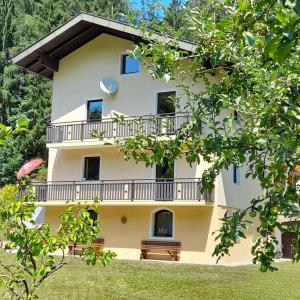 a large white building with a balcony at Haus am Schloss in Bleiburg