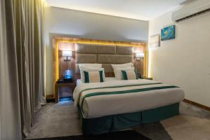 Postel nebo postele na pokoji v ubytování Rasia Hotel Jeddah