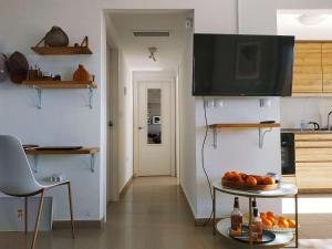 a kitchen with a table with oranges on it at Casa Vista del Mar - Mojon Hills in Isla Plana