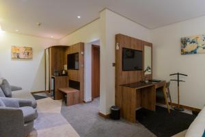 TV a/nebo společenská místnost v ubytování Rasia Hotel Jeddah