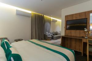 Postel nebo postele na pokoji v ubytování Rasia Hotel Jeddah