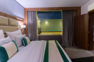 Postel nebo postele na pokoji v ubytování Rasia Hotel Jeddah