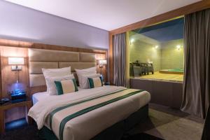 Postel nebo postele na pokoji v ubytování Rasia Hotel Jeddah