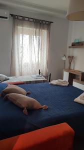 Lova arba lovos apgyvendinimo įstaigoje Casa Angelina