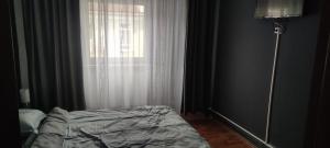 Ένα ή περισσότερα κρεβάτια σε δωμάτιο στο Apartament în regim Hotelier