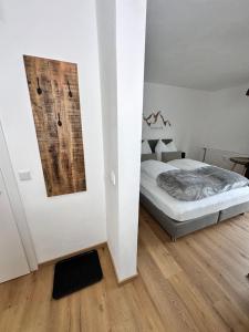 Postel nebo postele na pokoji v ubytování Grimming Lodge Tauplitz