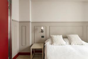 Letto o letti in una camera di Petronio Residence