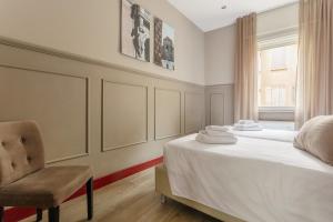 Letto o letti in una camera di Petronio Residence