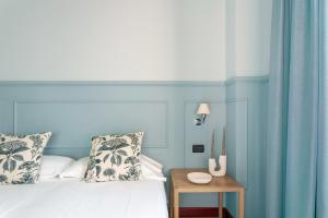 Letto o letti in una camera di Petronio Residence