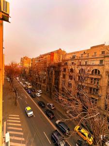 a city street with cars parked on the street at Ultracentral Apartment 4 rooms - Old City Center -120 square meters - in Bucharest