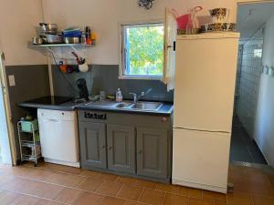 a kitchen with a sink and a counter top at Mazet avec jardin in Saint-Bauzille-de-Putois