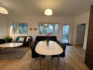 a living room with a couch and a table at Lyngby NO SMOKING Apt in Kongens Lyngby