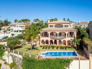an aerial view of a house with a swimming pool at Beachside villa with panoramic sea views in Benalmádena