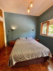 Säng eller sängar i ett rum på El PH de Chacarita