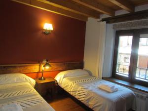 En eller flere senge i et værelse på Casa Rural la Esperilla de Gredos