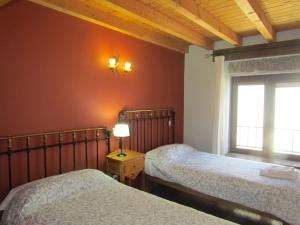 En eller flere senge i et værelse på Casa Rural la Esperilla de Gredos