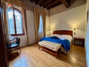 Postel nebo postele na pokoji v ubytování Locanda del Ghetto