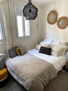 Säng eller sängar i ett rum på Vincennes Greater Paris JO 2024 Charming flat