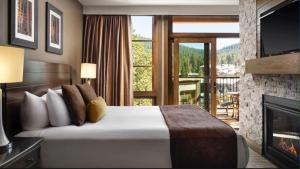 a hotel room with a bed and a fireplace at Hyatt Vacation Club at Northstar Lodge in Truckee +60 photos