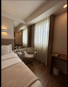 Кровать или кровати в номере QUARTO DUPLO - Suíte