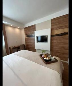 Кровать или кровати в номере QUARTO DUPLO - Suíte