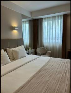 Кровать или кровати в номере QUARTO DUPLO - Suíte