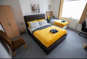 Säng eller sängar i ett rum på Northumberland Cozy Palace