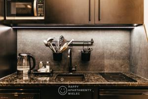 Kuchyňa alebo kuchynka v ubytovaní Happy Nest - ApartamentyHappy pl