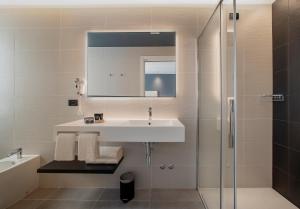 a bathroom with a sink and a shower at Hotel Sayonara in Lido di Jesolo