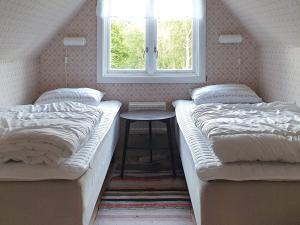 Postel nebo postele na pokoji v ubytování 8 person holiday home in Annerstad-By Traum