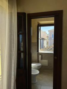 a bathroom with a toilet and a window at B&B Rivellini in Tropea +63 photos