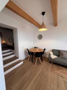 a living room with a table and a couch at calMar Tenerife 1 in Los Realejos