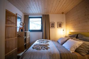 Posteľ alebo postele v izbe v ubytovaní VILLETTA Apartmán