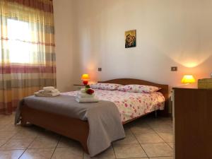 A bed or beds in a room at Casa Vacanze Mareblù
