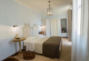a bedroom with a bed and a dresser at Villa Sant'Angelo in Alba Adriatica