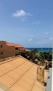 a roof of a building with a view of the ocean at Residencial Ilha do Fogo app 205 in Santa Maria