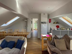 a living room with a couch and a table at The Hayloft, Marsden in Huddersfield