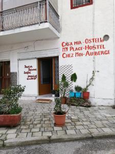 a building with a sign on the side of it at Casa Mia in Vlorë