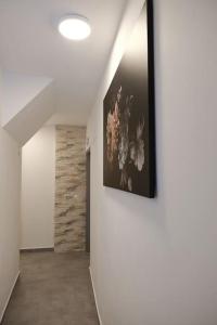 a hallway with a painting hanging on a wall at SchlossCasa Lauf an der Pegnitz (Paris) in Lauf an der Pegnitz