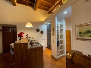 a kitchen with a island in a room at Casa Vacanze Palazzo Primoli in Ariccia