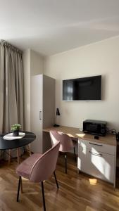 TV a/nebo společenská místnost v ubytování Cozy rooms in Villa Heermeyer