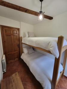 Postel nebo postele na pokoji v ubytování El Refugio de Gredos