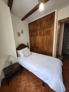 Postel nebo postele na pokoji v ubytování El Refugio de Gredos