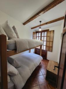 Postel nebo postele na pokoji v ubytování El Refugio de Gredos